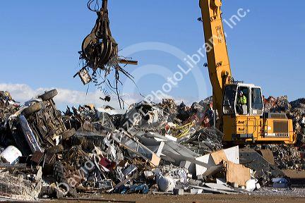 Hydraulic grapple lifting scrap steel for recycling at the Pacific Steel and Recycling center in Elmore County, Idaho.
