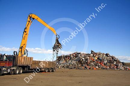 Hydraulic grapple lifting scrap steel for recycling at the Pacific Steel and Recycling center in Elmore County, Idaho.