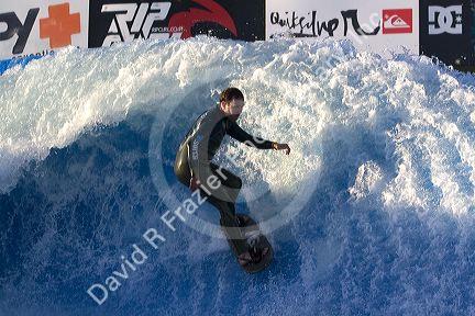 Man surfing on a man made wave machine at Mission Beach, San Diego, Southern California, USA.