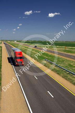 Long haul truck traveling on Interstate 70 in Russell County, Kansas, USA.