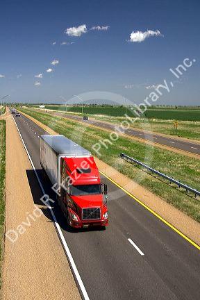 Long haul truck traveling on Interstate 70 in Russell County, Kansas, USA.