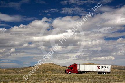 Long haul truck traveling on Interstate 80 in Carbon County, Wyoming, USA.