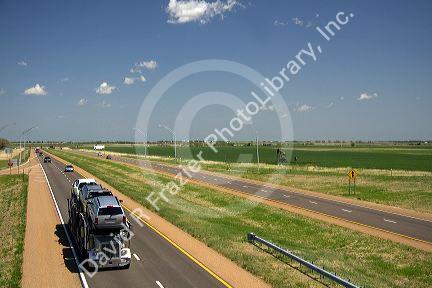 Long haul truck traveling on Interstate 70 in Russell County, Kansas, USA.