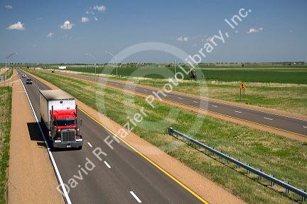 Long haul truck traveling on Interstate 70 in Russell County, Kansas, USA.