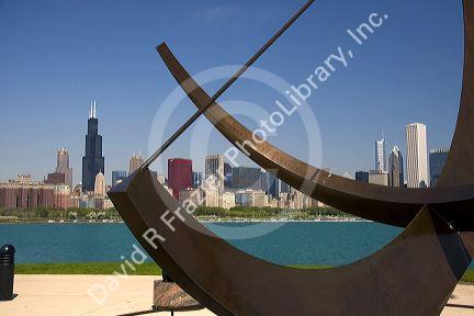 Cast bronze sundial sculpture named Man Enters the Cosmos by artist Henry Moore located on Lake Michigan outside the Adler Planetarium in Chicago, Illinois, USA.