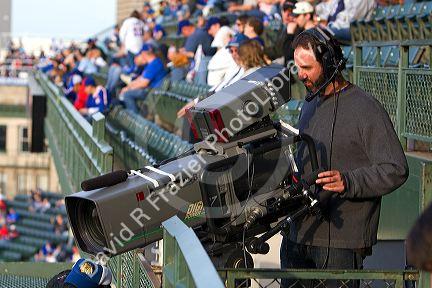 Television Cameraman  at Cubs baseball game at Wrigley Field in Chicago, Illlinois, USA.