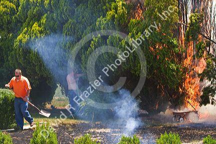 Homeowners try to put out a residential fire in Canyon County, Idaho, USA.