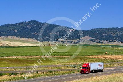 Truck transporting freight along Interstate 84 near North Powder, Oregon, USA.