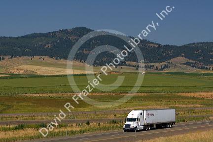 Truck transporting freight along Interstate 84 near North Powder, Oregon, USA.