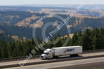 Truck transporting freight through the Blue Mountains near Pendleton, Oregon, USA.