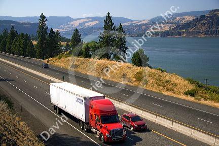 Truck transporting freight through the Columbia River Gorge near Hood River, Oregon, USA.