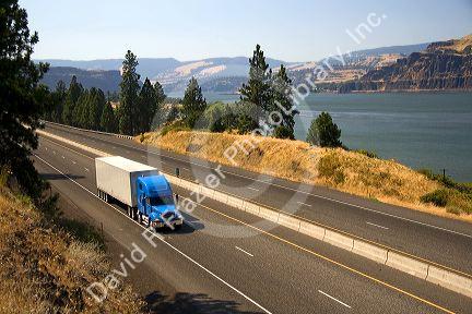 Truck transporting freight through the Columbia River Gorge near Hood River, Oregon, USA.