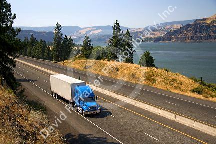 Truck transporting freight through the Columbia River Gorge near Hood River, Oregon, USA.