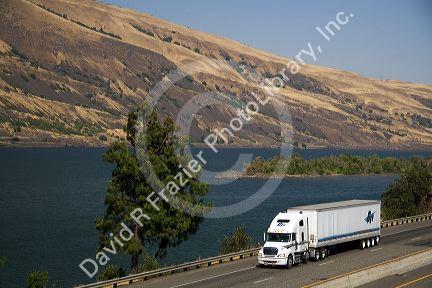 Truck transporting freight through the Columbia River Gorge near Hood River, Oregon, USA.