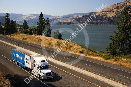 Truck transporting freight through the Columbia River Gorge near Hood River, Oregon, USA.