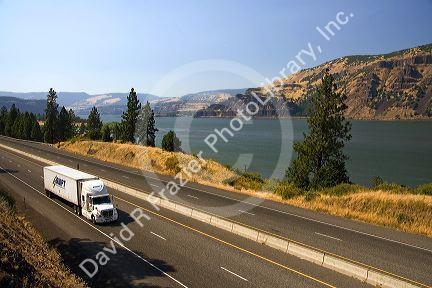 Truck transporting freight through the Columbia River Gorge near Hood River, Oregon, USA.