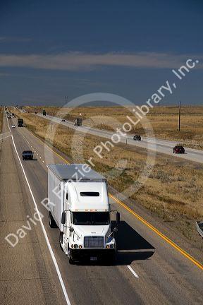 Commercial transport truck traveling on Interstate 84 near Boise, Idaho, USA.