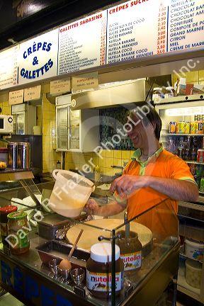 French man working at a Creperie in the Latin Quarter of Paris, France.