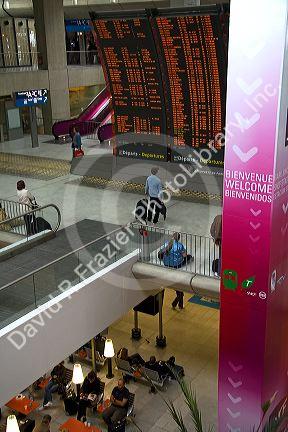 Departure board located in the Paris-Charles de Gaulle Airport, Paris, France.