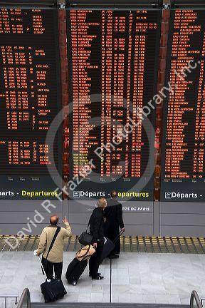 Departure board located in the Paris-Charles de Gaulle Airport, Paris, France.