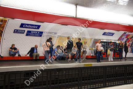 People wait underground on the platform of Chatelet Paris Metro station in Paris, France.