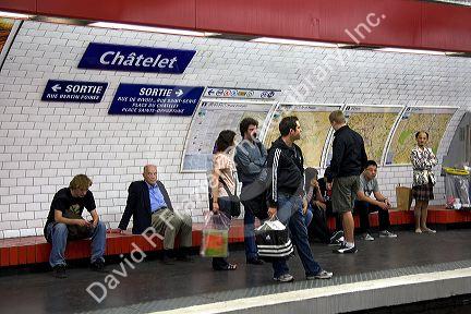 People wait underground on the platform of Chatelet Paris Metro station in Paris, France.