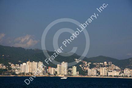 Acapulco Bay lined with hotels in Acapulco, Guerrero, Mexico.