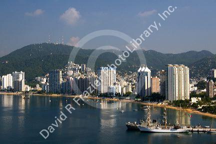 Acapulco Bay lined with hotels in Acapulco, Guerrero, Mexico.