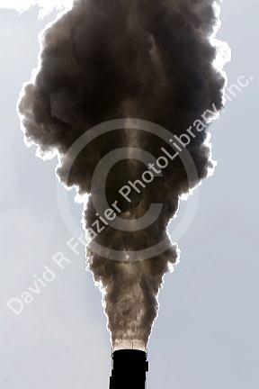 Industrial smokestack venting hot flue gases.