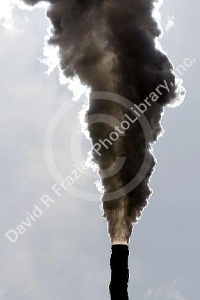 Industrial smokestack venting hot flue gases.