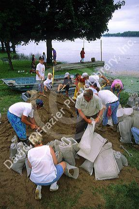 Volunteers sandbag for a flooded Mississippi River in Princeton, Iowa, USA.