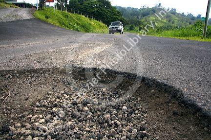 Pothole in the surface of a roadway near the town of Nuevo Arenal, Costa Rica.