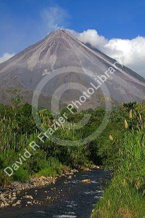 Arenal Volcano and fresh water stream near La Fortuna, San Carlos, Costa Rica.
