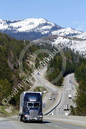 Vehicles travel on Interstate 80 near Donner Pass in the Sierra Nevada mountains, California, USA.
