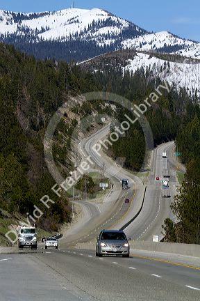 Vehicles travel on Interstate 80 near Donner Pass in the Sierra Nevada mountains, California, USA.