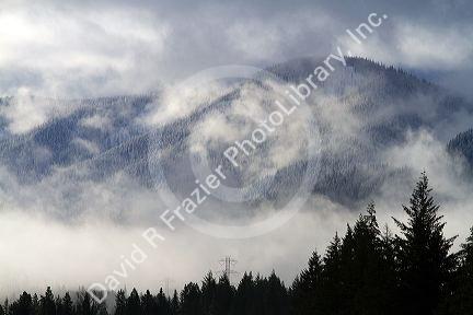 Fog and low clouds over the Cascade Range along Interstate 90 near Ellensburg, Washington, USA.