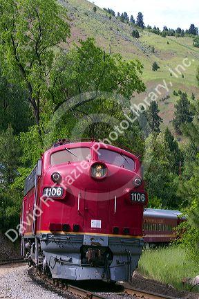 The Thunder Mountain Line scenic tourist train traveling along the Payette River between Horseshoe Bend and Banks, Idaho, USA.