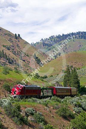 The Thunder Mountain Line scenic tourist train traveling along the Payette River between Horseshoe Bend and Banks, Idaho, USA.