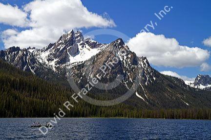 Canoeing on Stanley Lake in the Sawtooth Mountain Range near Stanley, Idaho, USA.