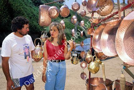 A woman shopping for copper in Chile.