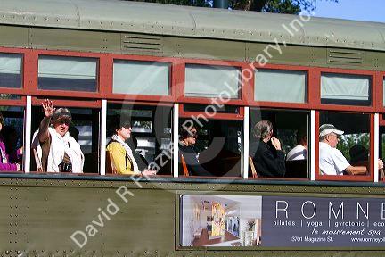 Passengers on the St. Charles Streetcar Line in the Garden District of New Orleans, Louisiana, USA.