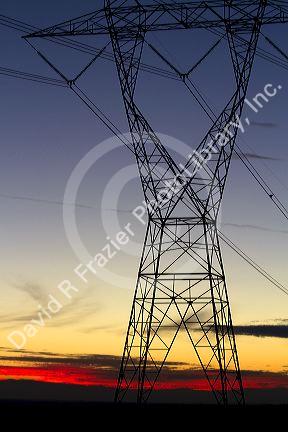 Electric transmission tower and sunset near Boise, Idaho, USA.