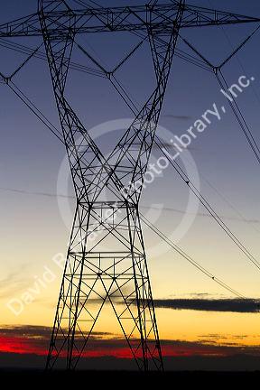 Electric transmission tower and sunset near Boise, Idaho, USA.