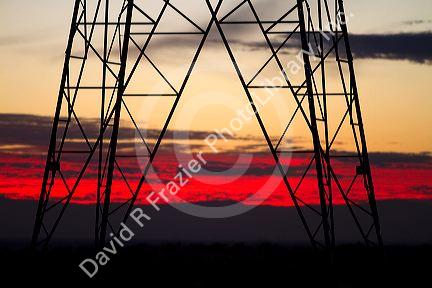 Electric transmission tower and sunset near Boise, Idaho, USA.