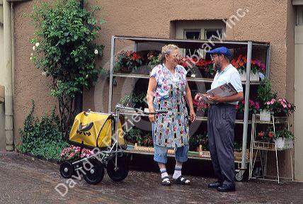 A postman bringing the mail to a resident in Germany.