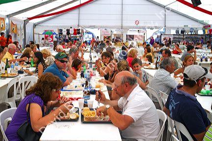 People dine on seafood and paella at a Fisherman Festival in Mar del Plata, Argentina.