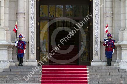 Gaurds at the Government Palace of Peru also known as the House of Pizarro, located on the north side of Plaza Mayor in Lima, Peru.