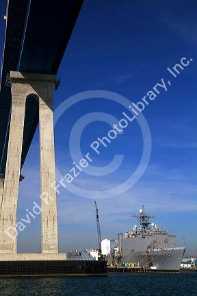 Navy ship under the Coronado Bridge in San Diego, California, USA.