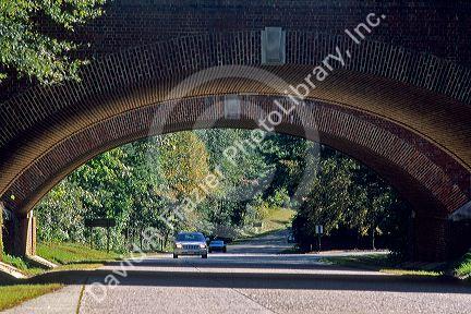 Colonial Parkway with arched brick bridge in Jamestown, Virginia.