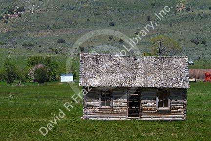 Log cabin on ranch land along Idaho State Highway 77 near Almo, Idaho, USA.